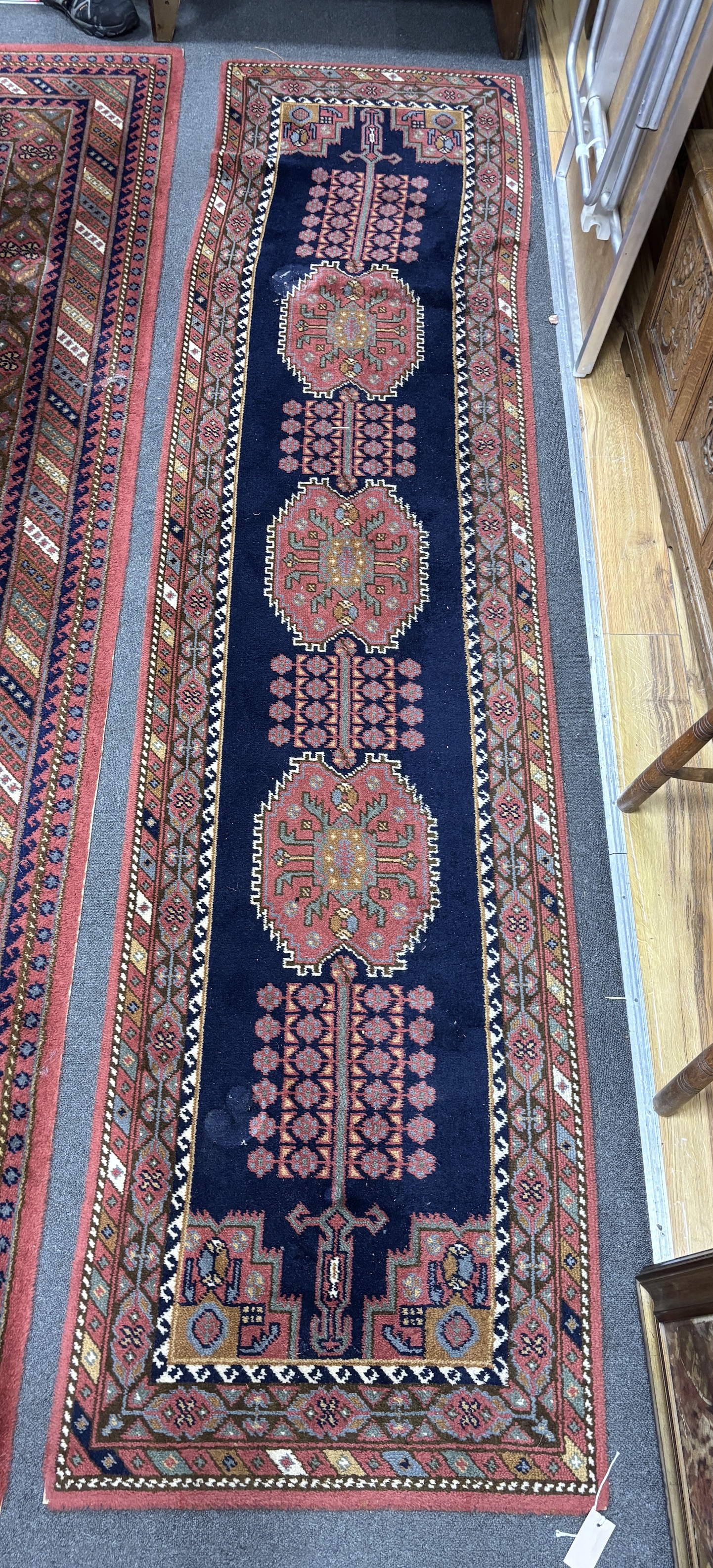 A North West Persian style machined blue ground carpet together with a similar runner, larger 295 x 190cm